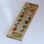 Game With Wooden Board And Marbles